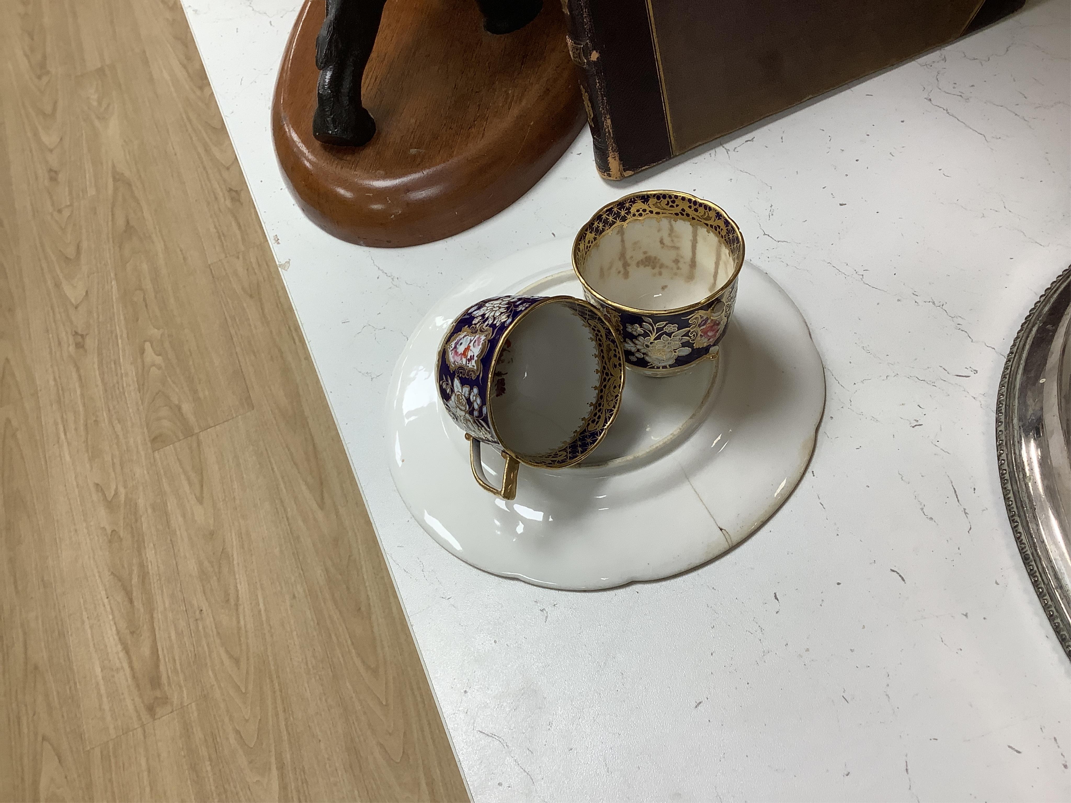 An early 19th century English porcelain tea service, possibly Coalport, moulded in low relief with floral reserves and cobalt blue border. Condition - varies